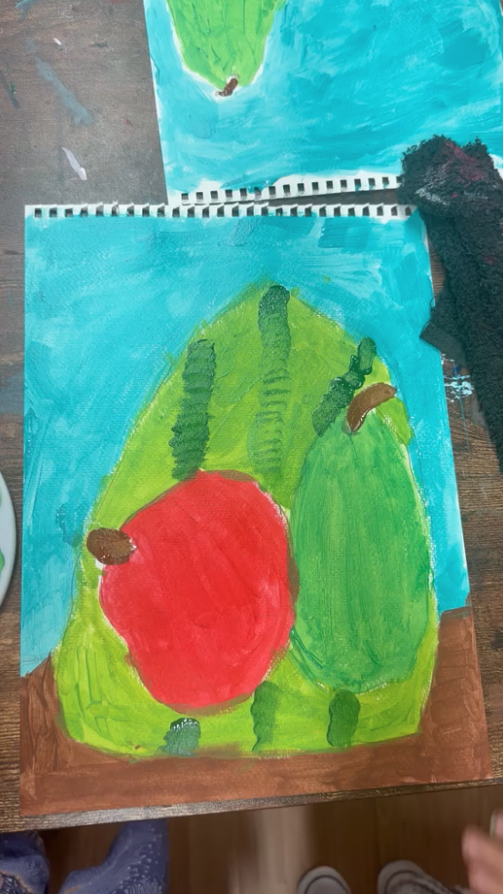 Painting of an apple and pear on blue background